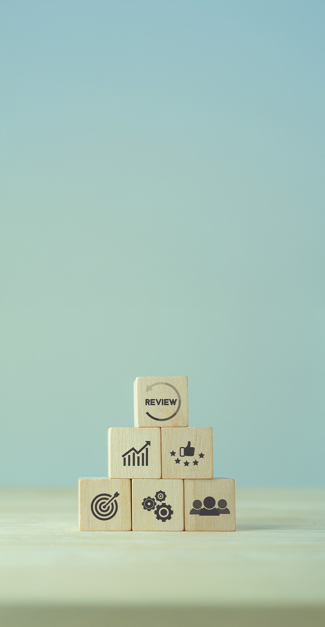 Performance metrics illustrated on wooden blocks